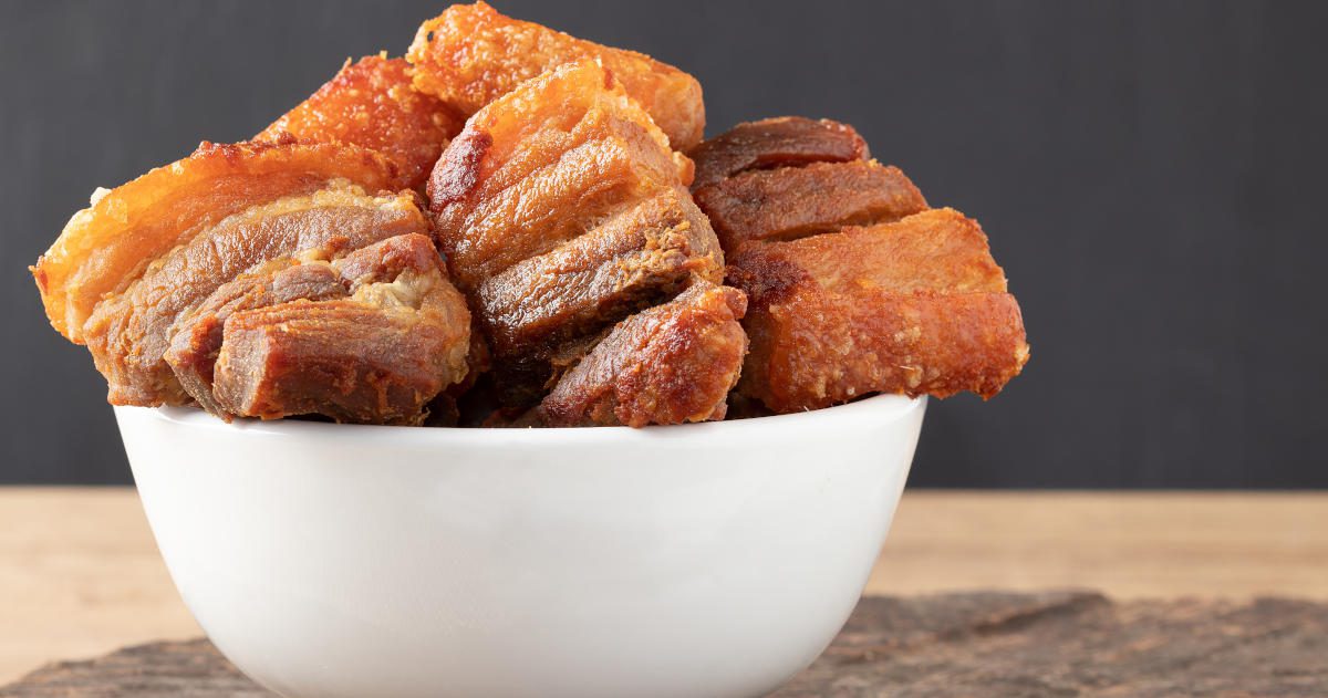 Delicious pancetta made with fried meat pork belly in a bowl. Selective focus. Delicious pancetta made with fried meat pork belly in a bowl. Selective focus